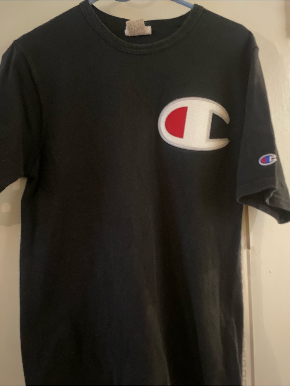 Champion Black Short-Sleeve Tee with Red & White Logo Patch